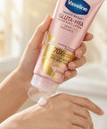 Vaseline Gluta-Hya lotion being applied to a hand with a soft background