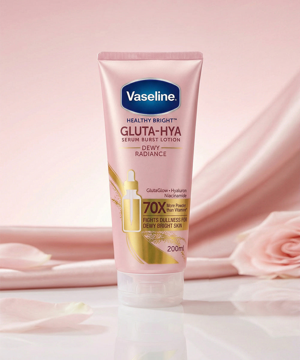 Vaseline Gluta-Hya lotion tube on a pink fabric background with roses.