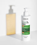 Vichy Dercos shampoo bottle on a white background
